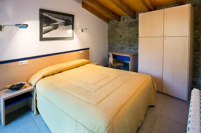 Cama o camas de una habitación en Allotjament Rural Cal Miquel