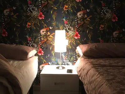 Cama o camas de una habitación en Hostal Casa Michaels