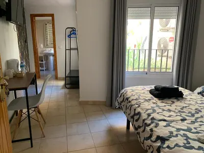 Cama o camas de una habitación en Hostal Casa Michaels