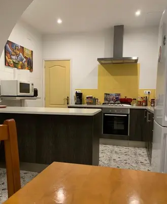 Una cocina o zona de cocina en Hostal Casa Michaels