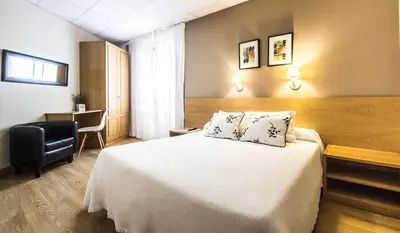 Cama o camas de una habitación en Hotel Casa Jacinto Pamplona