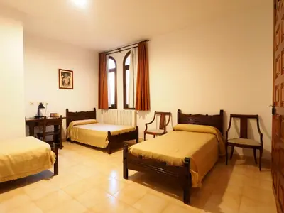 Cama o camas de una habitación en Monasterio El Olivar