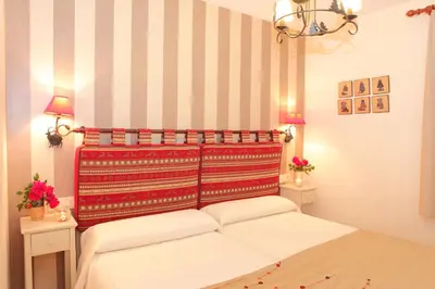 Cama o camas de una habitación en Apartamentos Albá Casa Alquesera