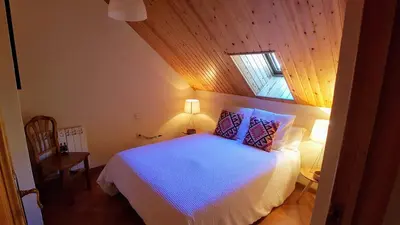 Cama o camas de una habitación en Atico duplex Urb La Viña en Biescas