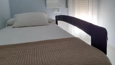 Cama o camas de una habitación en Alcañiz Flats II