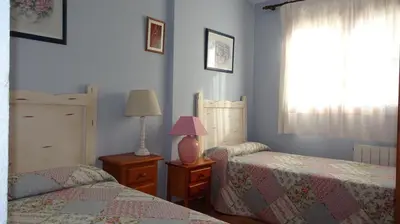 Cama o camas de una habitación en Piso grande en el centro de Jaca con WIFI y garaje