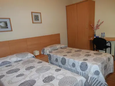 Cama o camas de una habitación en Hostal Sant Roc