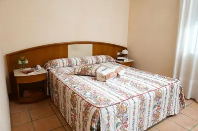 Cama o camas de una habitación en Hotel Rural Jaumet