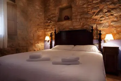 Cama o camas de una habitación en Apartamentos Doña Candida