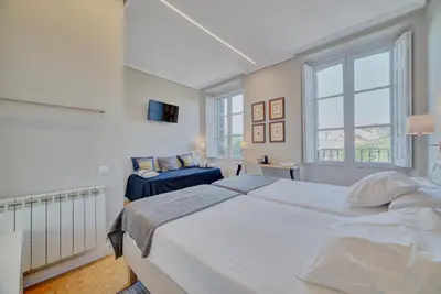 Cama o camas de una habitación en Pensión Mendi