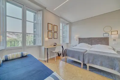 Cama o camas de una habitación en Pensión Mendi