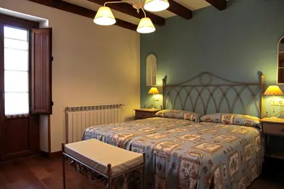 Cama o camas de una habitación en Casa Rural Juliana