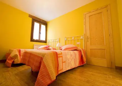 Cama o camas de una habitación en Apartamentos Cañardo Autural