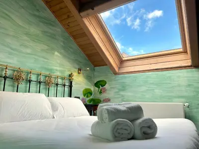 Cama o camas de una habitación en La Posada d'Àneu by RdA Hotels