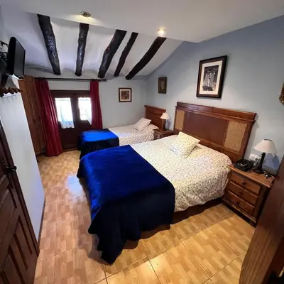 Cama o camas de una habitación en Posada Abadia de Sietamo