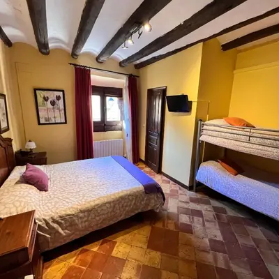 Cama o camas de una habitación en Posada Abadia de Sietamo