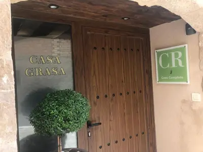 Certificado, premio, señal o documento que está expuesto en Casa Grasa
