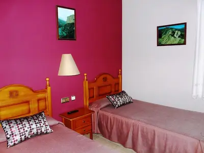 Cama o camas de una habitación en Hostal Rural Casa Castro