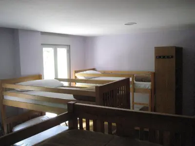 Cama o camas de una habitación en Albergue Turístico Rio Aragon