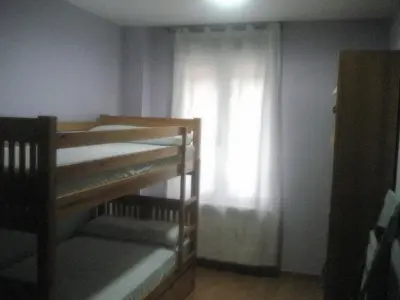 Cama o camas de una habitación en Albergue Turístico Rio Aragon