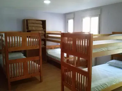 Cama o camas de una habitación en Albergue Turístico Rio Aragon