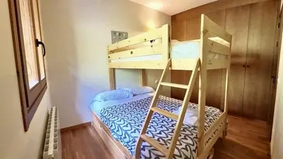Cama o camas de una habitación en Los Altos de Escarrilla - tucasaenlospirineos