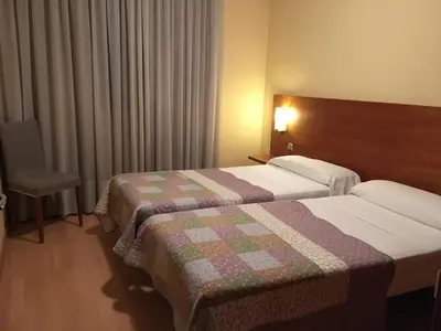 Cama o camas de una habitación en Hotel Torre Monreal
