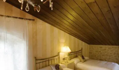 Cama o camas de una habitación en Casa rural l'Avellana