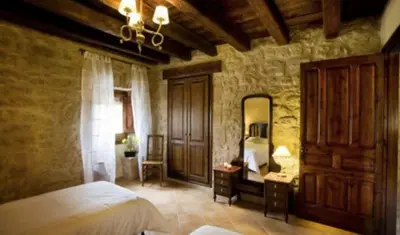 Cama o camas de una habitación en Casa rural l'Avellana
