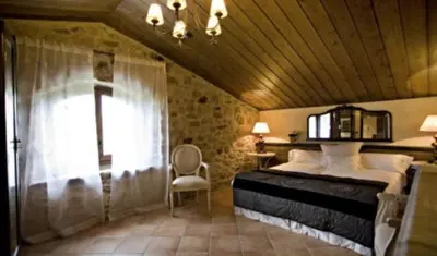 Cama o camas de una habitación en Casa rural l'Avellana