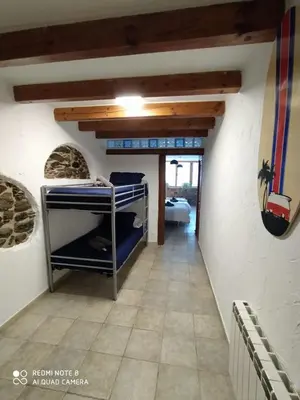 Cama o camas de una habitación en Cal Jardiner