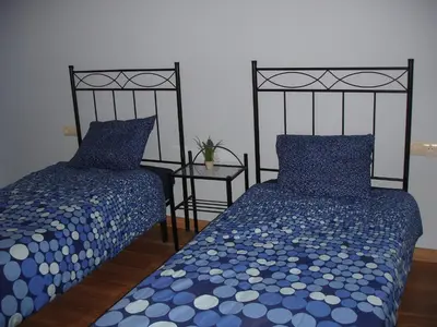 Cama o camas de una habitación en Apartamentos La Muralla
