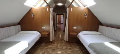 Cama o camas de una habitación en HOSTAL MENDILATZ