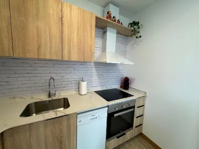Una cocina o zona de cocina en Apartamentos Montejurra