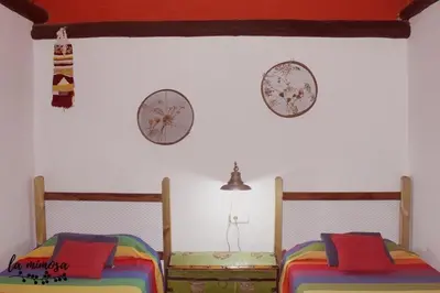 Cama o camas de una habitación en La mimosa