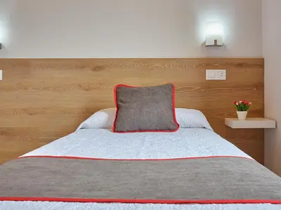 Cama o camas de una habitación en Hostal Nobadis