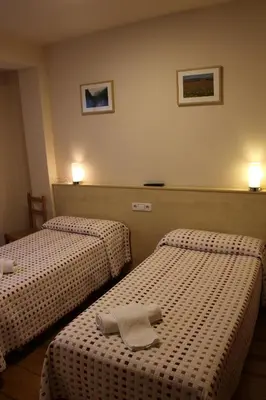 Cama o camas de una habitación en Hostal Ezkaurre