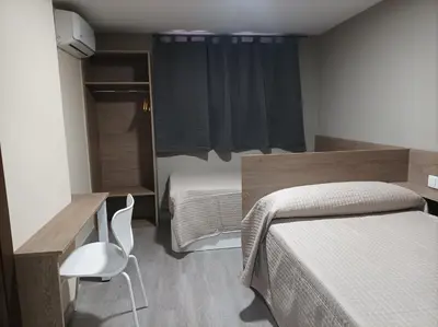 Cama o camas de una habitación en Hotel Balfagón