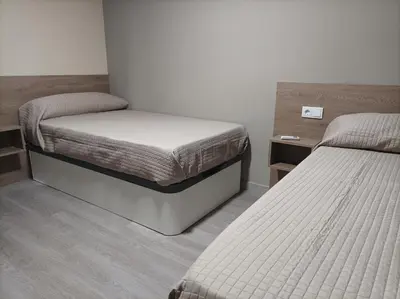 Cama o camas de una habitación en Hotel Balfagón