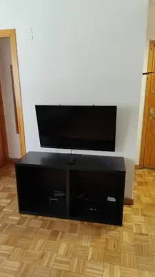 Una televisión o centro de entretenimiento en Apto VIELHA CENTRO Internet fibra