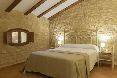 Cama o camas de una habitación en Masia Villa Pilar Valderrobres