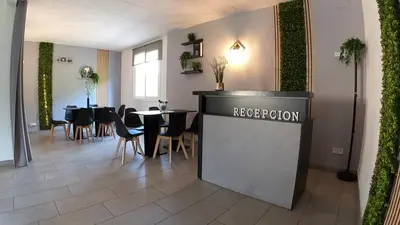 Un restaurante o sitio para comer en Alojamientos Turísticos TURBON - Campo