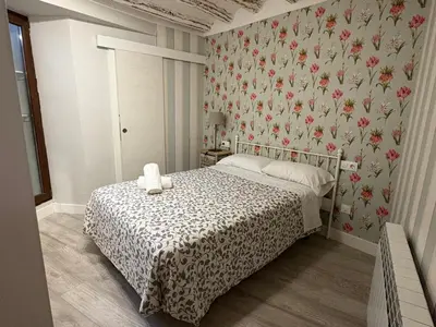 Cama o camas de una habitación en Apartamentos Vino Tinto y Restaurante Tomate Rosa