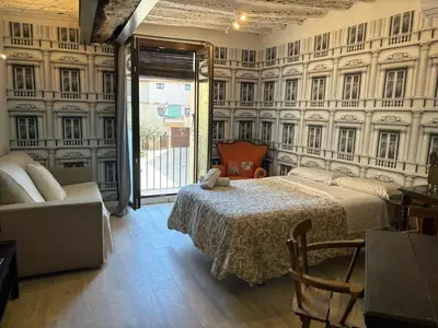 Cama o camas de una habitación en Apartamentos Vino Tinto y Restaurante Tomate Rosa