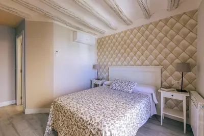 Cama o camas de una habitación en Apartamentos Vino Tinto y Restaurante Tomate Rosa
