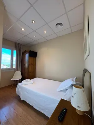 Cama o camas de una habitación en Hotel Restaurante El Colono