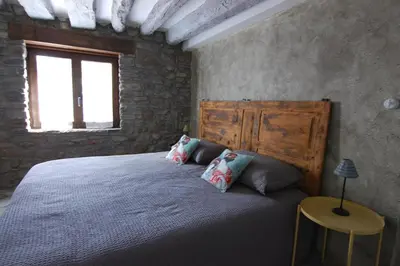 Cama o camas de una habitación en Apartamento El Fenal de Turmo Casa rural 