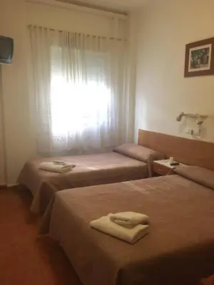 Cama o camas de una habitación en PENSION MIRAFLORES