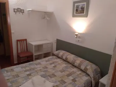 Cama o camas de una habitación en PENSION MIRAFLORES