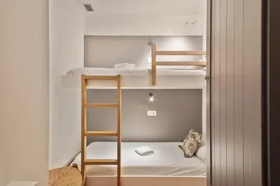 Cama o camas de una habitación en Luderna - Apartamento con terraza Bonaigua B2 Salient